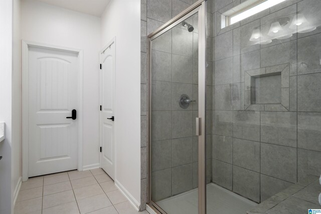 8659 Clarke Ln, Leeds, AL 35094 - full bath featuring tile patterned floors, a shower stall, and baseboards