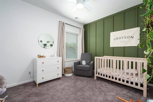 8659 Clarke Ln, Leeds, AL 35094 - carpeted bedroom featuring a crib, baseboards, a ceiling fan, and visible vents