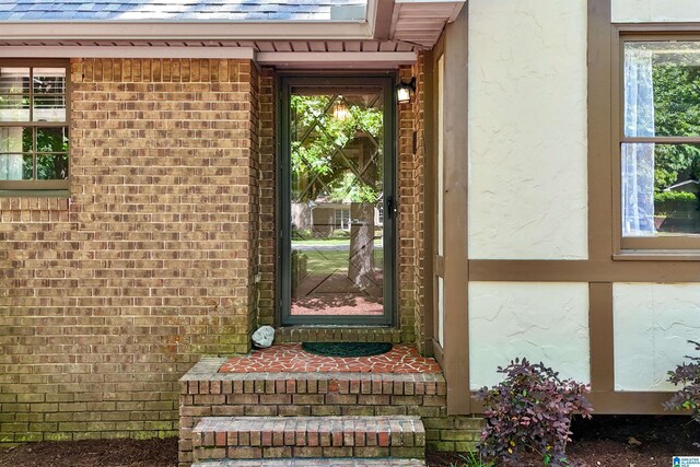 6522 Quail Run Dr, Pelham, AL 35124 - doorway to property featuring brick siding and roof with shingles