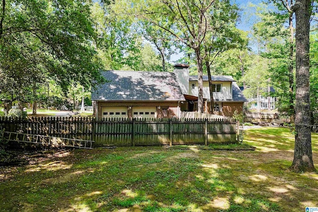 6522 Quail Run Dr, Pelham, AL 35124 - fenced yard featuring an attached garage