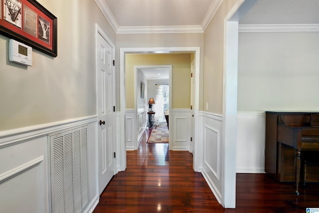 6522 Quail Run Dr, Pelham, AL 35124 - hallway with wood-type flooring, a wainscoted wall, crown molding, and a decorative wall