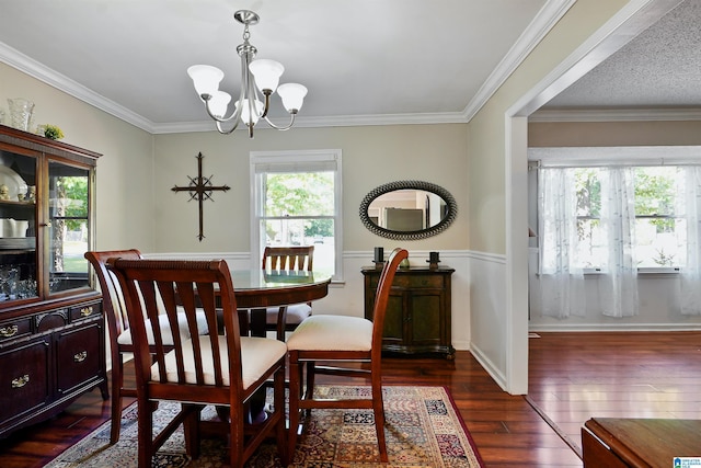 6522 Quail Run Dr, Pelham, AL 35124 - dining area with dark wood finished floors, a chandelier, ornamental molding, and wainscoting
