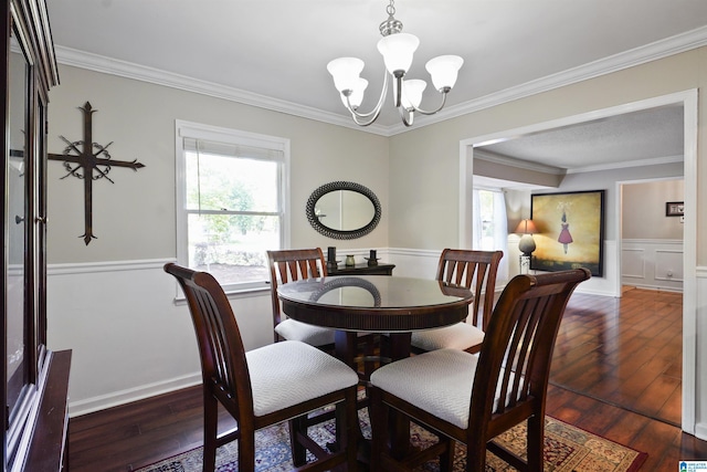 6522 Quail Run Dr, Pelham, AL 35124 - dining area with a chandelier, ornamental molding, hardwood / wood-style flooring, and wainscoting