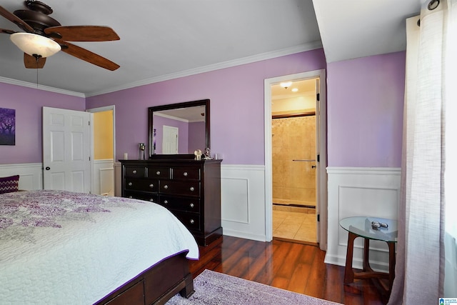 6522 Quail Run Dr, Pelham, AL 35124 - bedroom with wainscoting, dark wood-type flooring, ornamental molding, ensuite bath, and a ceiling fan