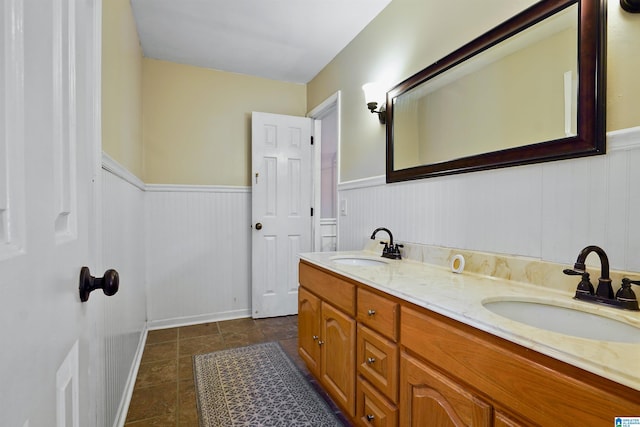 6522 Quail Run Dr, Pelham, AL 35124 - bathroom with a wainscoted wall and double vanity