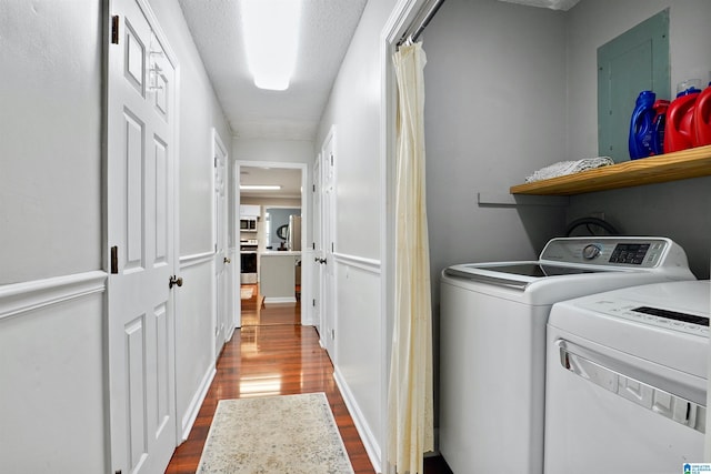 6522 Quail Run Dr, Pelham, AL 35124 - laundry room with dark wood finished floors, independent washer and dryer, and electric panel