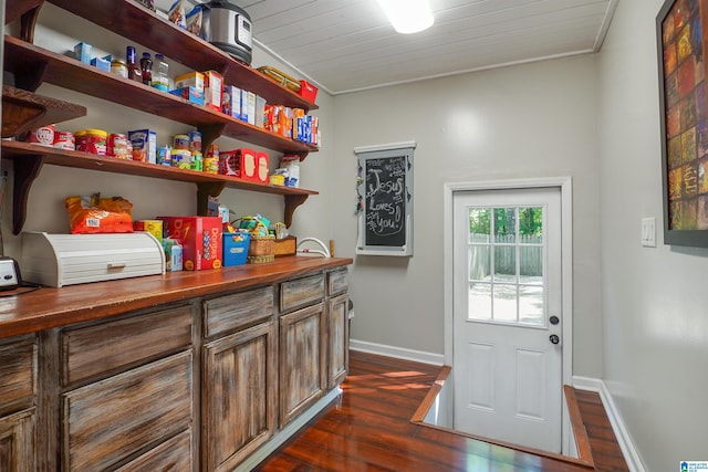 6522 Quail Run Dr, Pelham, AL 35124 - doorway with dark wood-style floors, baseboards, and crown molding