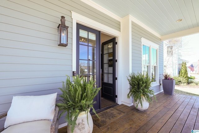 property entrance with covered porch