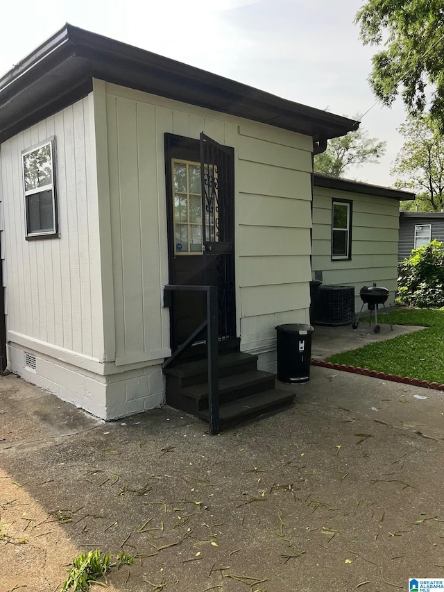 view of outbuilding featuring cooling unit
