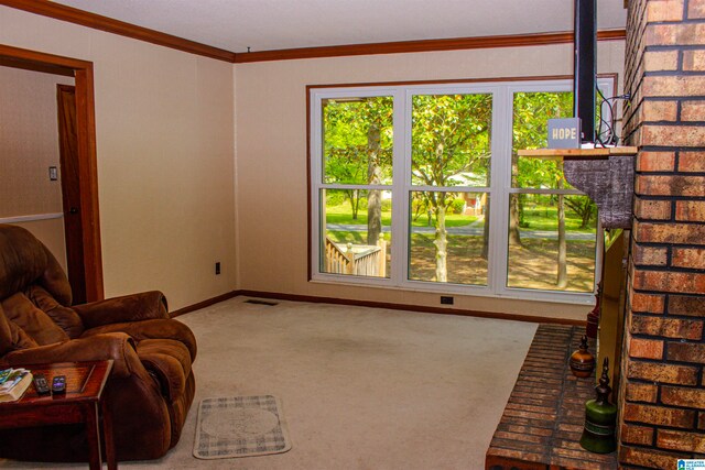 carpeted living room with baseboards, visible vents, and ornamental molding