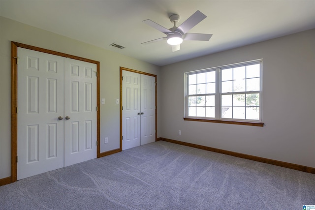 5251 Vintage Way, Mccalla, AL 35111 - unfurnished bedroom featuring baseboards, multiple closets, carpet, and visible vents