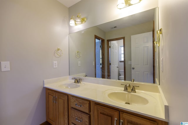 5251 Vintage Way, Mccalla, AL 35111 - bathroom with double vanity, toilet, and a sink
