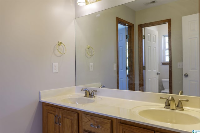 5251 Vintage Way, Mccalla, AL 35111 - bathroom with double vanity, toilet, visible vents, and a sink