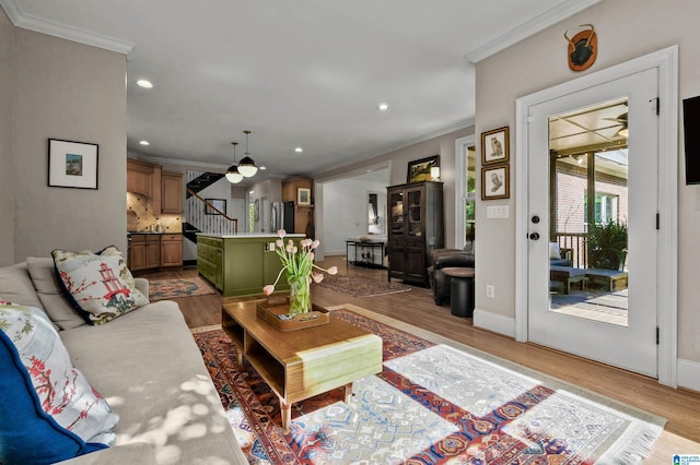 living room with recessed lighting, stairway, crown molding, and wood finished floors