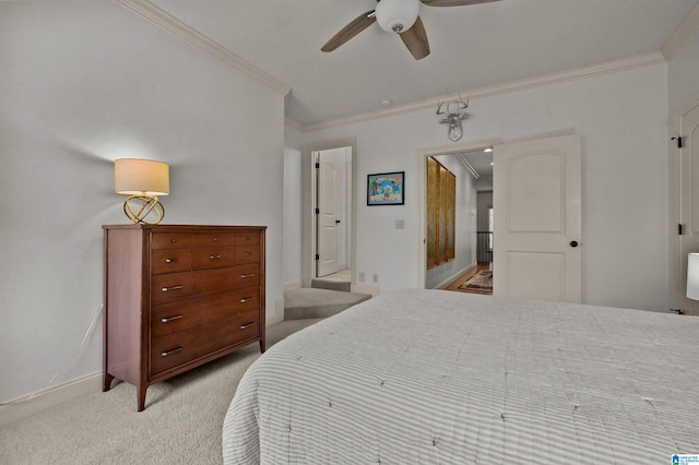 bedroom featuring light colored carpet, baseboards, a ceiling fan, and ornamental molding