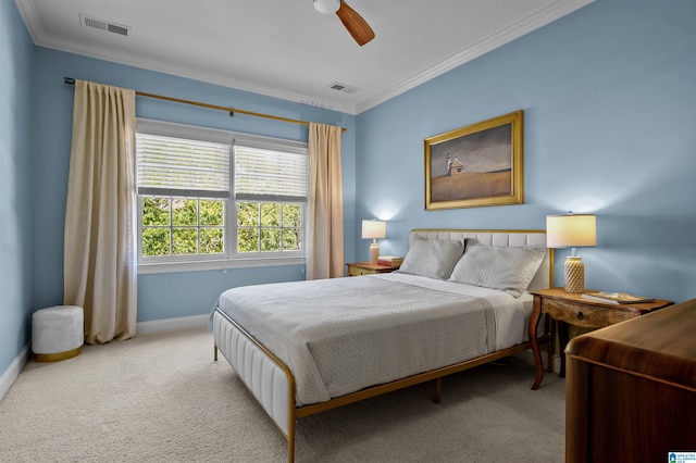 carpeted bedroom with ornamental molding, baseboards, and visible vents