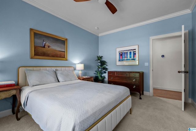 bedroom featuring light colored carpet, baseboards, a ceiling fan, and ornamental molding