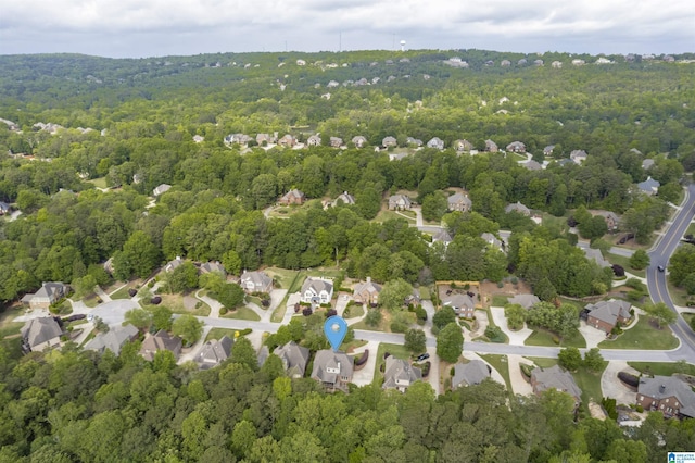 aerial view featuring a wooded view