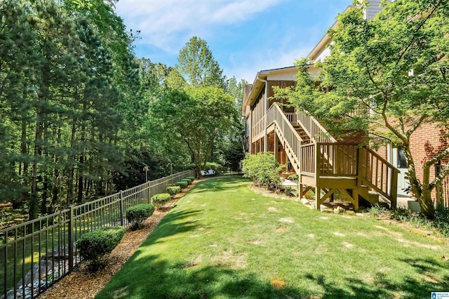view of yard with stairway and a fenced backyard