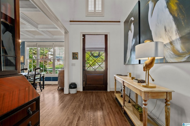 foyer entrance with coffered ceiling, wood finished floors, baseboards, and ornamental molding