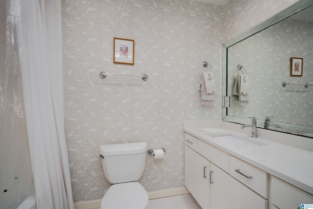 full bathroom featuring tile patterned floors, toilet, baseboards, and vanity