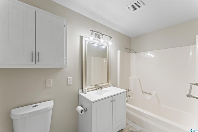 603 Danton Ln, Irondale, AL 35210 - full bathroom featuring washtub / shower combination, vanity, toilet, and visible vents