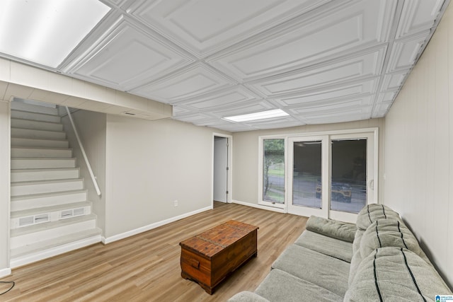 603 Danton Ln, Irondale, AL 35210 - living room featuring stairs, baseboards, and light wood-style flooring