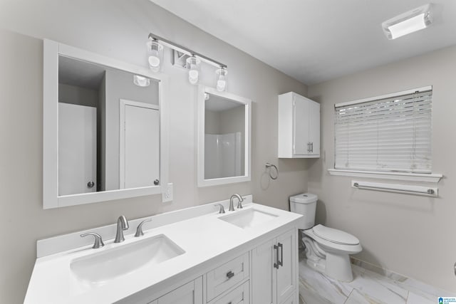 603 Danton Ln, Irondale, AL 35210 - bathroom with a sink, toilet, double vanity, and marble finish floor
