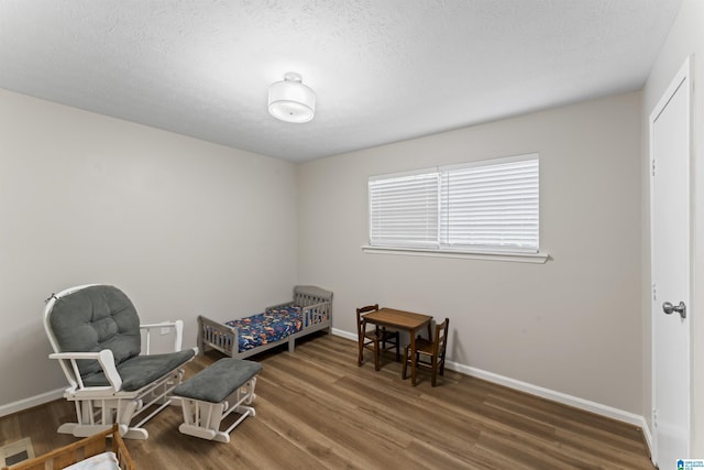 603 Danton Ln, Irondale, AL 35210 - living area with a textured ceiling, baseboards, and wood finished floors