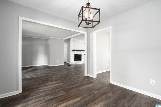1006 Cannon Cir, Birmingham, AL 35235 - unfurnished dining area featuring an inviting chandelier, baseboards, and dark wood finished floors