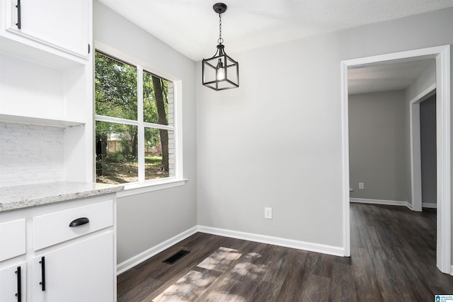 1006 Cannon Cir, Birmingham, AL 35235 - unfurnished dining area featuring baseboards, visible vents, and dark wood finished floors