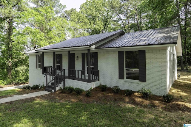 1006 Cannon Cir, Birmingham, AL 35235 - ranch-style home with brick siding, covered porch, and metal roof