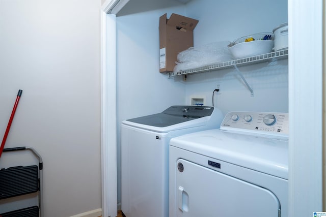 laundry room featuring washer and dryer and laundry area