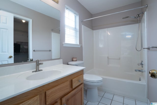 bathroom featuring tile patterned flooring, tub / shower combination, toilet, and vanity