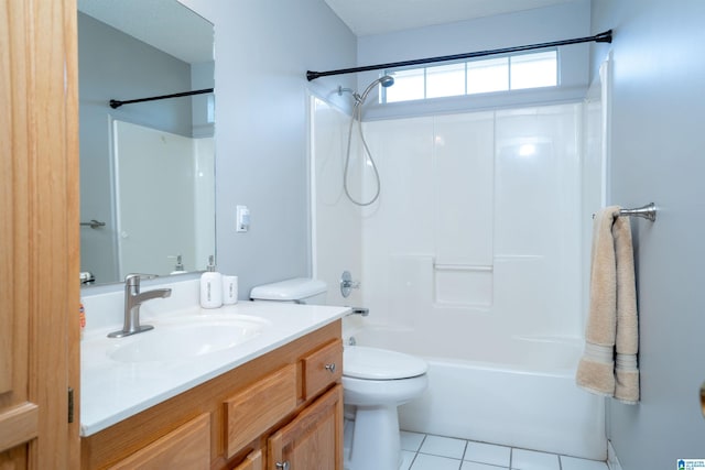 bathroom with toilet,  shower combination, tile patterned flooring, and vanity