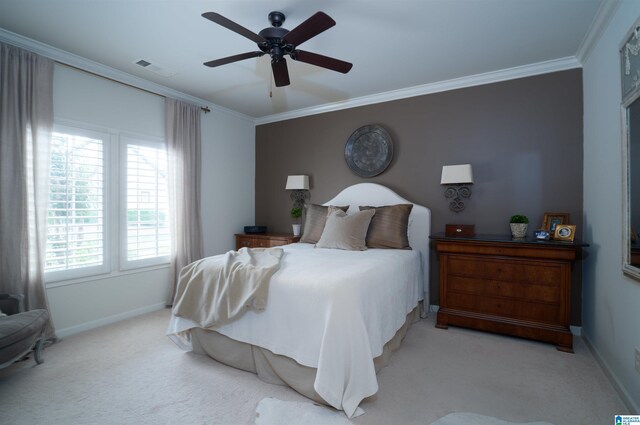 bedroom featuring carpet floors, crown molding, and baseboards