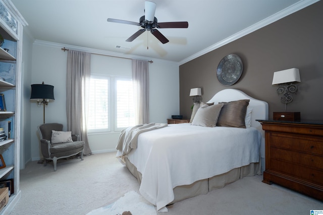 carpeted bedroom featuring visible vents, baseboards, crown molding, and ceiling fan
