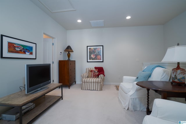 living area with recessed lighting, baseboards, light colored carpet, and visible vents