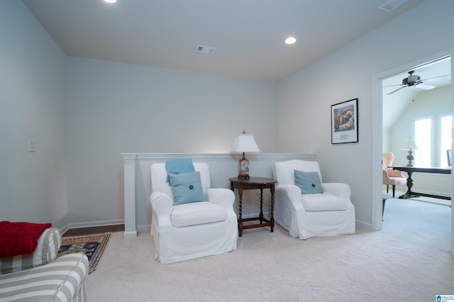 living area featuring visible vents, carpet flooring, baseboards, and recessed lighting