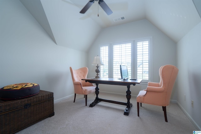 office space with a ceiling fan, visible vents, vaulted ceiling, baseboards, and carpet