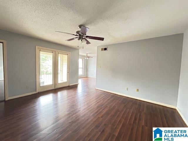 3217 Chase Ln Unit 3217, Birmingham, AL 35215 - unfurnished room with ceiling fan, a textured ceiling, baseboards, wood finished floors, and visible vents