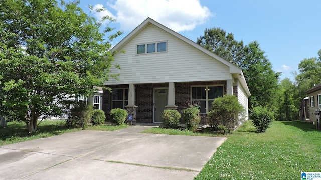 316 Creek Run Cir, Calera, AL 35040 - view of front of property with a front lawn, brick siding, and covered porch