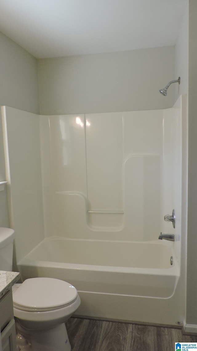 316 Creek Run Cir, Calera, AL 35040 - full bath with toilet, vanity, wood finished floors, and washtub / shower combination