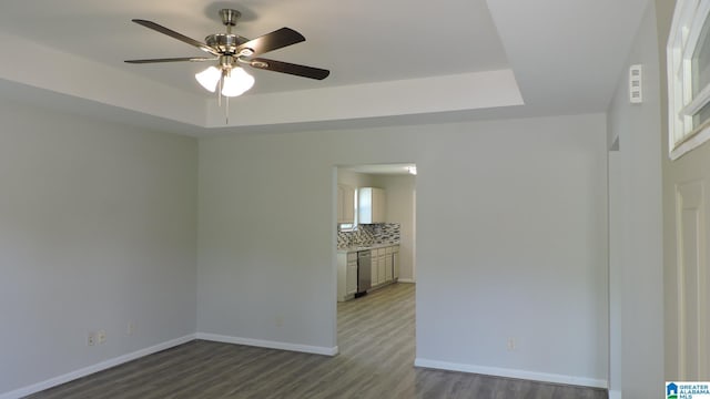 316 Creek Run Cir, Calera, AL 35040 - spare room with a raised ceiling, ceiling fan, wood finished floors, and baseboards
