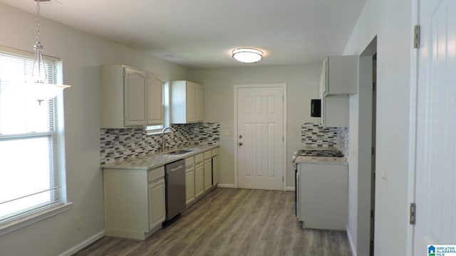 316 Creek Run Cir, Calera, AL 35040 - kitchen featuring a sink, dishwasher, light countertops, and decorative backsplash