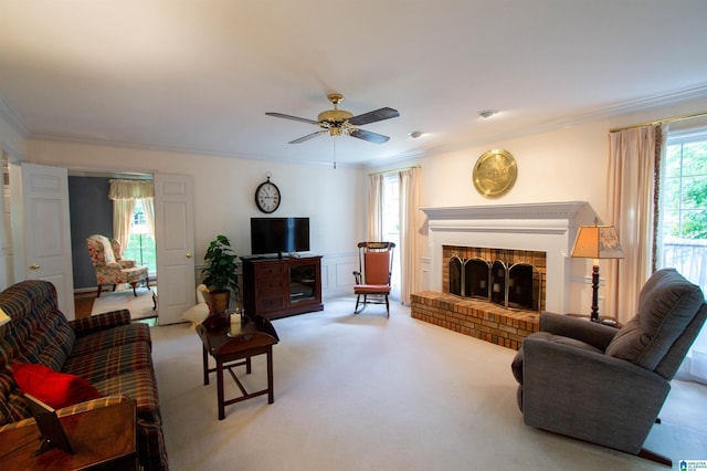 836 Tulip Poplar Dr, Hoover, AL 35244 - carpeted living area featuring crown molding, a ceiling fan, and a fireplace