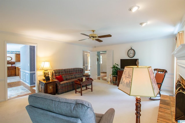 836 Tulip Poplar Dr, Hoover, AL 35244 - living room with crown molding, a fireplace, ceiling fan, and light carpet