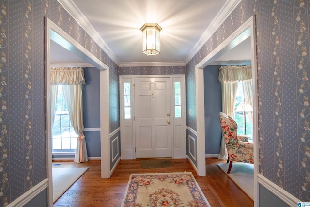 836 Tulip Poplar Dr, Hoover, AL 35244 - entrance foyer with wallpapered walls, wood finished floors, baseboards, plenty of natural light, and ornamental molding