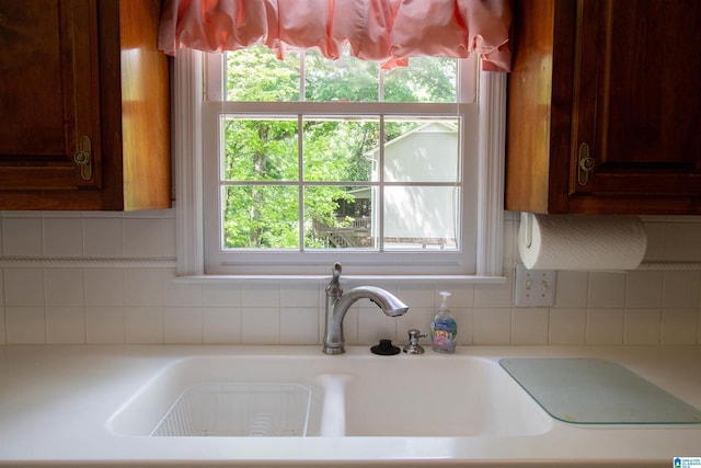 836 Tulip Poplar Dr, Hoover, AL 35244 - kitchen view of decorative backsplash, light countertops, and a sink