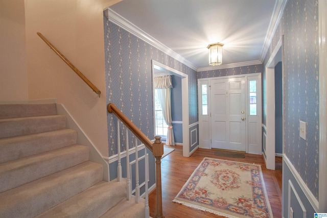 836 Tulip Poplar Dr, Hoover, AL 35244 - entryway with wallpapered walls, crown molding, stairway, wood finished floors, and baseboards